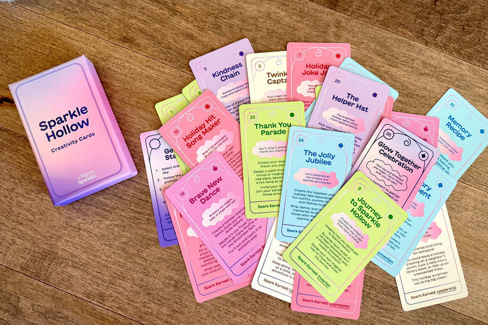 Collection of colorful cards on a wooden surface with a fluffy white rug in the background.